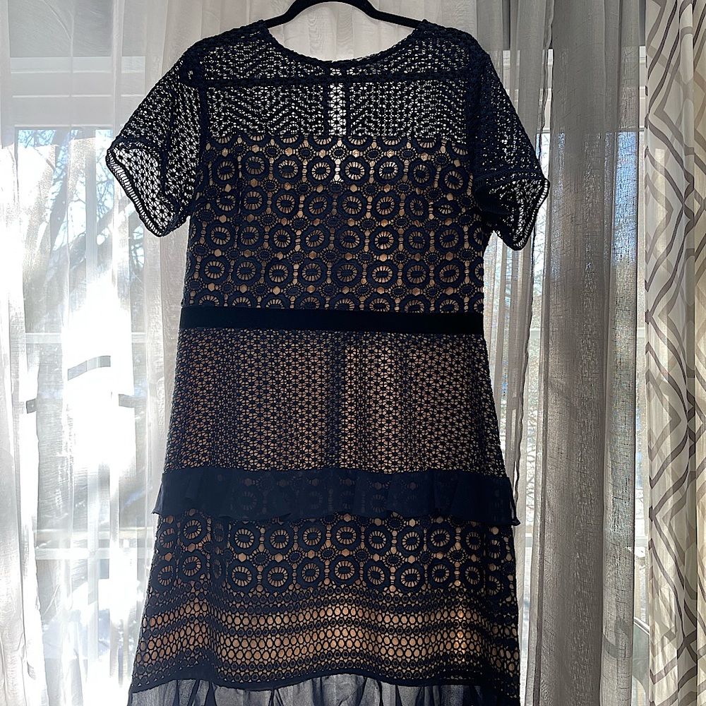 Lace and chiffon ruffle dress, trimmed at waist with velvet band. Sapphire blue